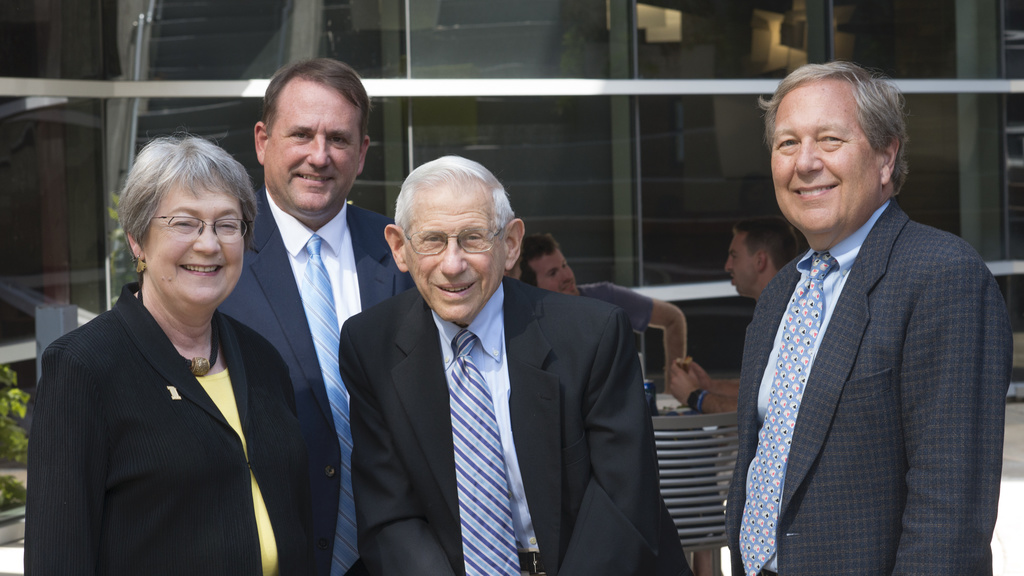 Gail Agrawal, Ted Seldin, and Bruce Harreld standing in the Ted M. Seldin Portico at the Boyd Law Building