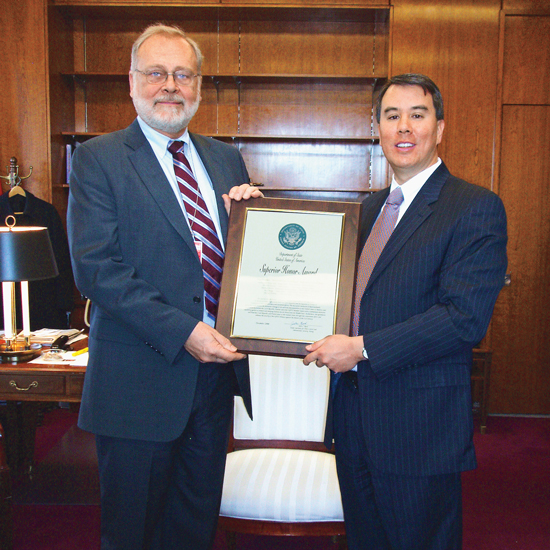 Don Timm (73JD) receives the Department of State Superior Honor Award