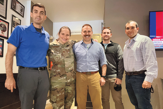 Several members of the defense team for Al-Tamir posing for a photo