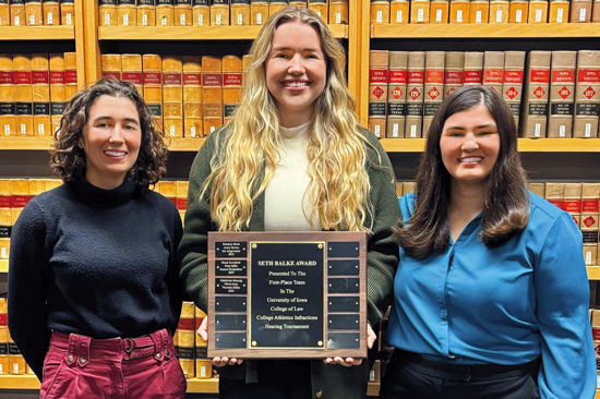 Three members of the winning team for the the Intramural College Athletics Infractions Hearing class competition.