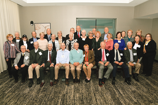 Members of the class of 1969, posing with their spouses at their 55th reunion.
