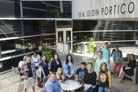 Group of Iowa Law students standing in the Ted M. Seldin Portico outside of the Boyd Law Building