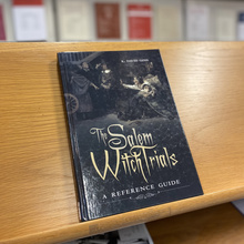 Book cover of the Salem Witch Trials: A Reference Guide displayed in the law library 