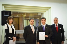 Iowa Law alum Aaron Miers with Kosovo Officials after completing externship  
