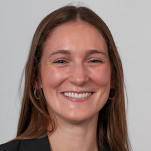 Jane Jazefowics, smiling against a white backdrop