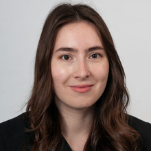 Madison Rush, smiling against a white backdrop.