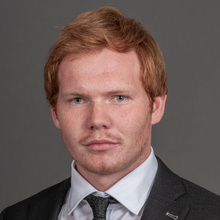 Haakan Thorsgard, posing against a gray backdrop.