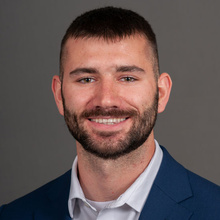 Tyson Williams, posing against a gray backdrop.
