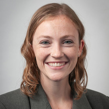 Miranda Ulses smiles for a professional photo against a light gray backdrop.