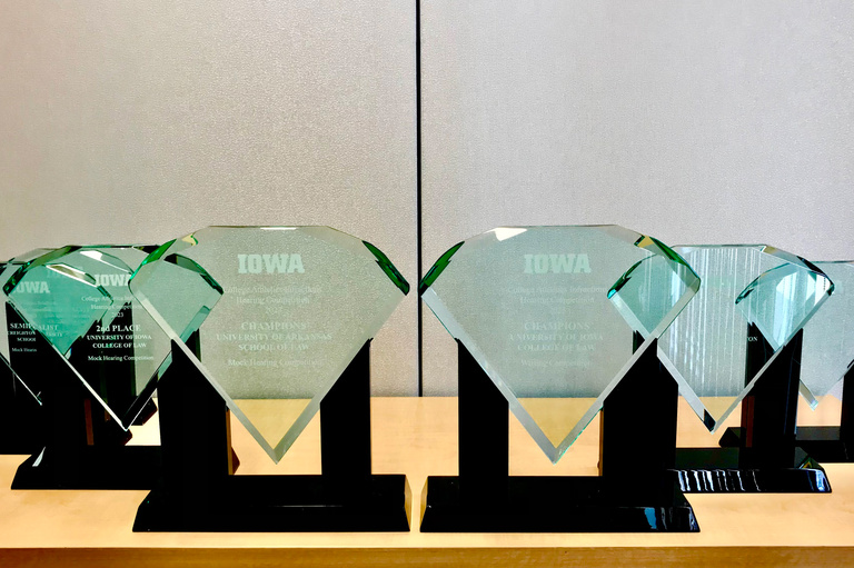 A lineup of trophies for the National College Athletics Infractions Hearing Competition