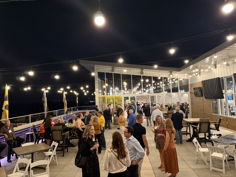 Iowa Law alumni gather for a reception on the roof top of The Heights during Reunion weekend