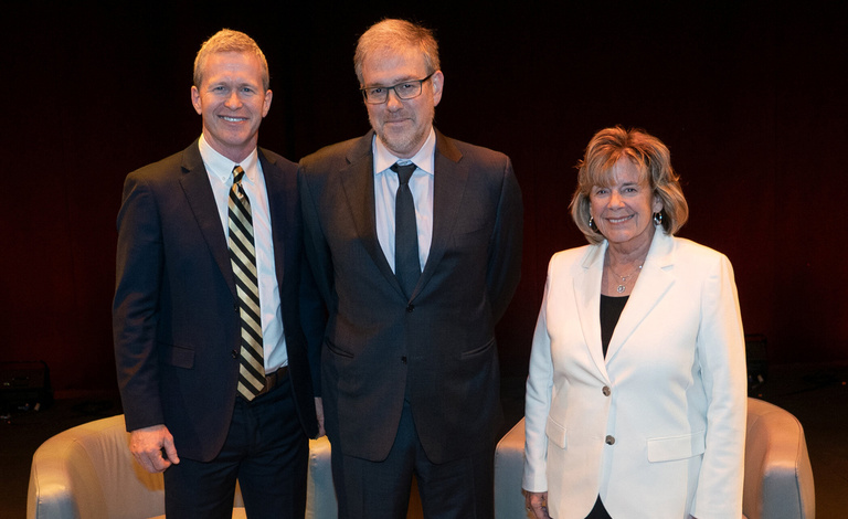 Bret Stephens (center) poses for a photo with College of Law Dean Todd Pettys (left) and University of Iowa President Barbara J. Wilson (right).