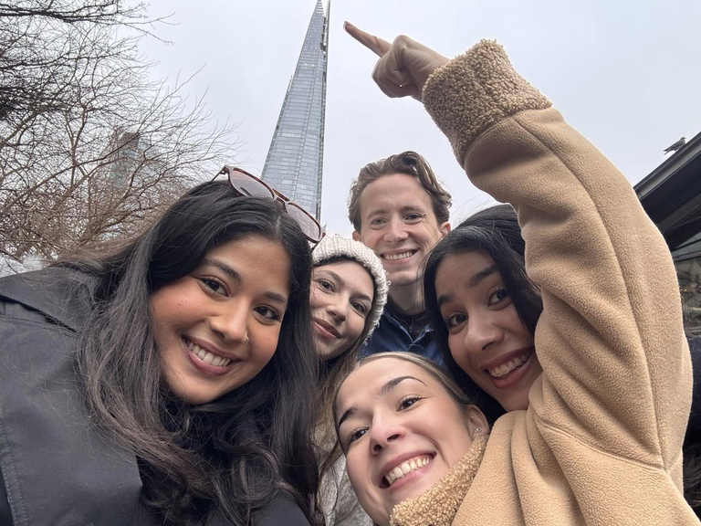 selfie of students pointing at The Shard