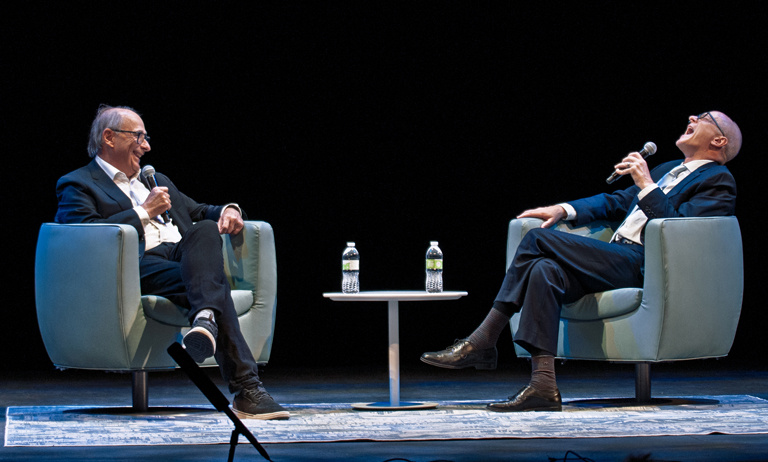 Axelrod makes host Ben Kieffer laugh during the lecture. 
