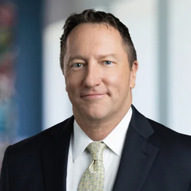 Jim Sawtelle, posing for a photo and smiling