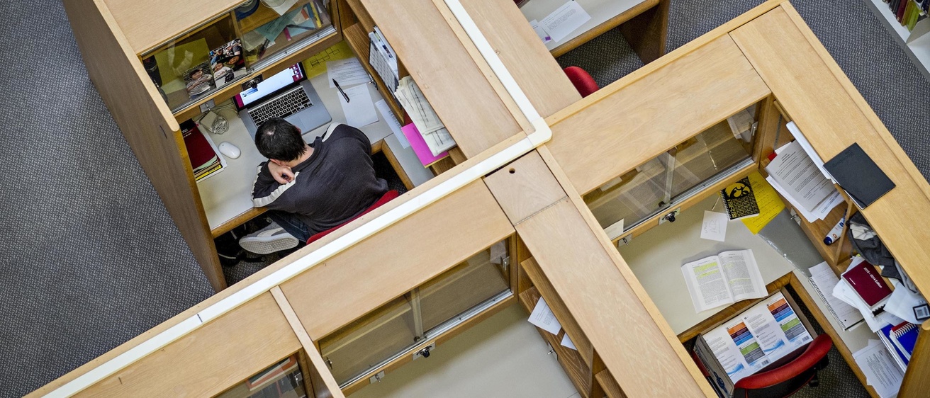 Aerial view of student studying in a study carrel in the Boyd Law Building 