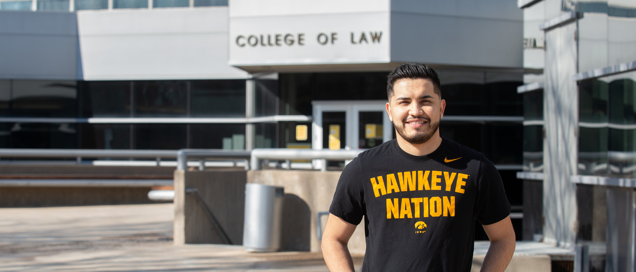 Eddie Ponce, Class of 2021, in front of the Boyd Law Building