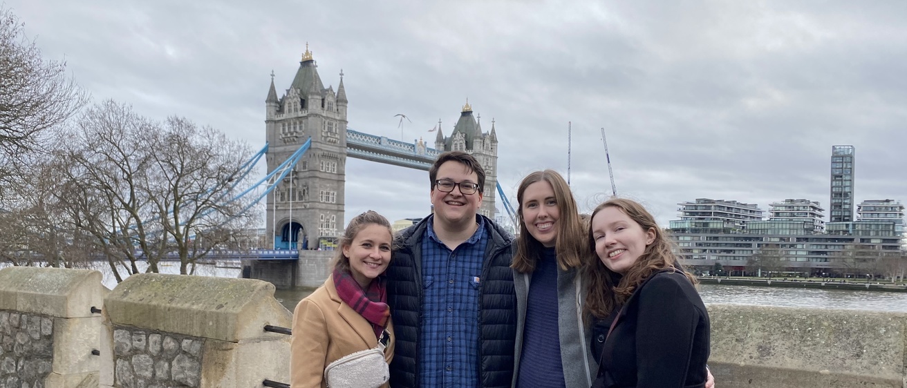 Students pose in front of the London Bridge during the London Intersession Program
