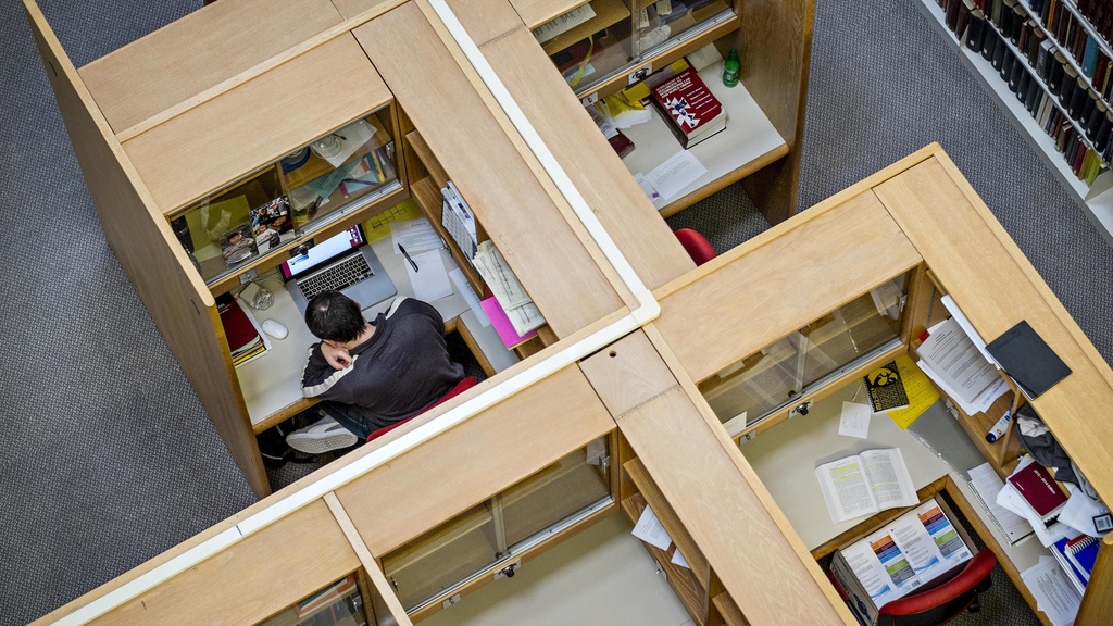 Aerial view of student studying in a study carrel in the Boyd Law Building 
